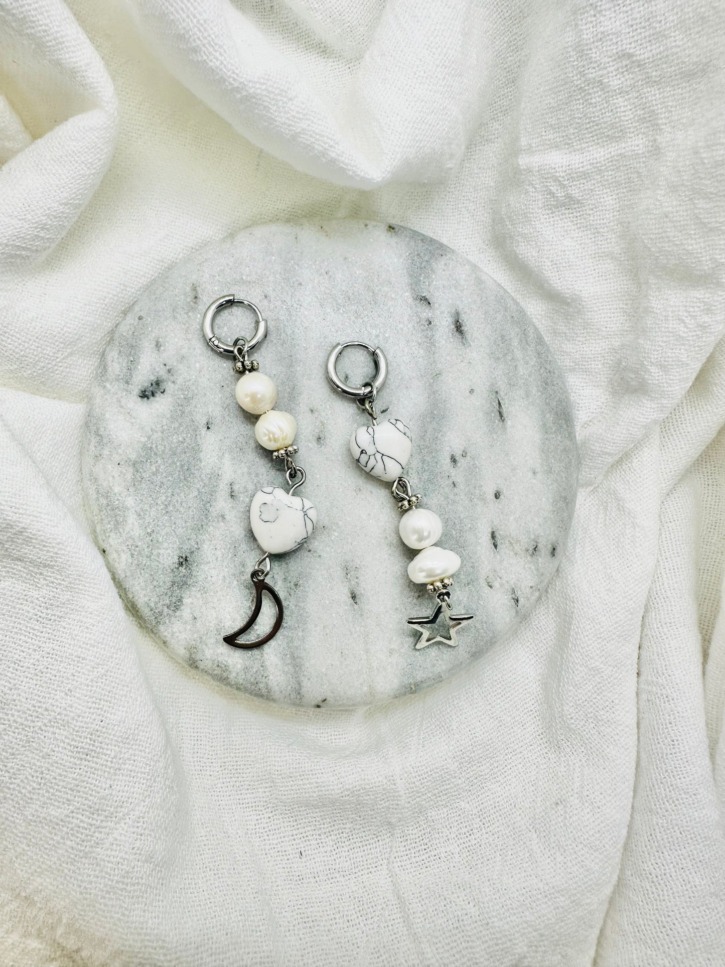 long silver earrings marble heart and pearls with moon and a  star.