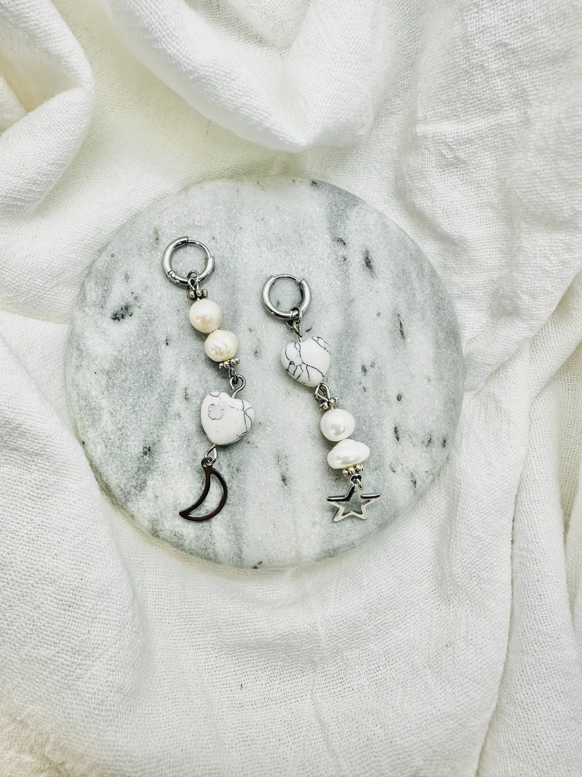 long silver earrings marble heart and pearls with moon and a  star.
